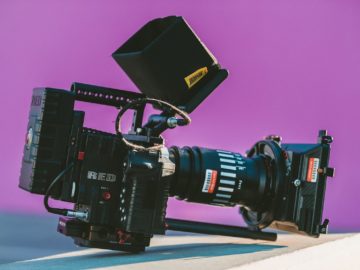 shallow focus photography of black professional video camera on table