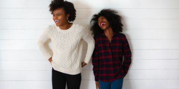 two woman smiling