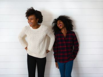 two woman smiling